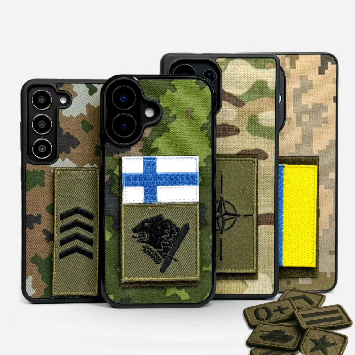 Sotilaskuoret puhelimelle tarramerkillä - Suomen, Ukrainan ja NATO merkeillä varustetut Lastu suojakuoret maastokuviolla