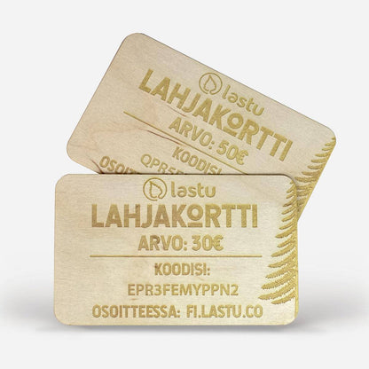 Kaksi puista Lastu-lahjakorttia, joissa lukee "Lahjakortti" ja "Arvo: 30€". Korteissa on yksilölliset koodit ja osoite fi.lastu.co. Sopii iPhone-, Samsung-, OnePlus- ja Google Pixel -puhelimille. Lastu