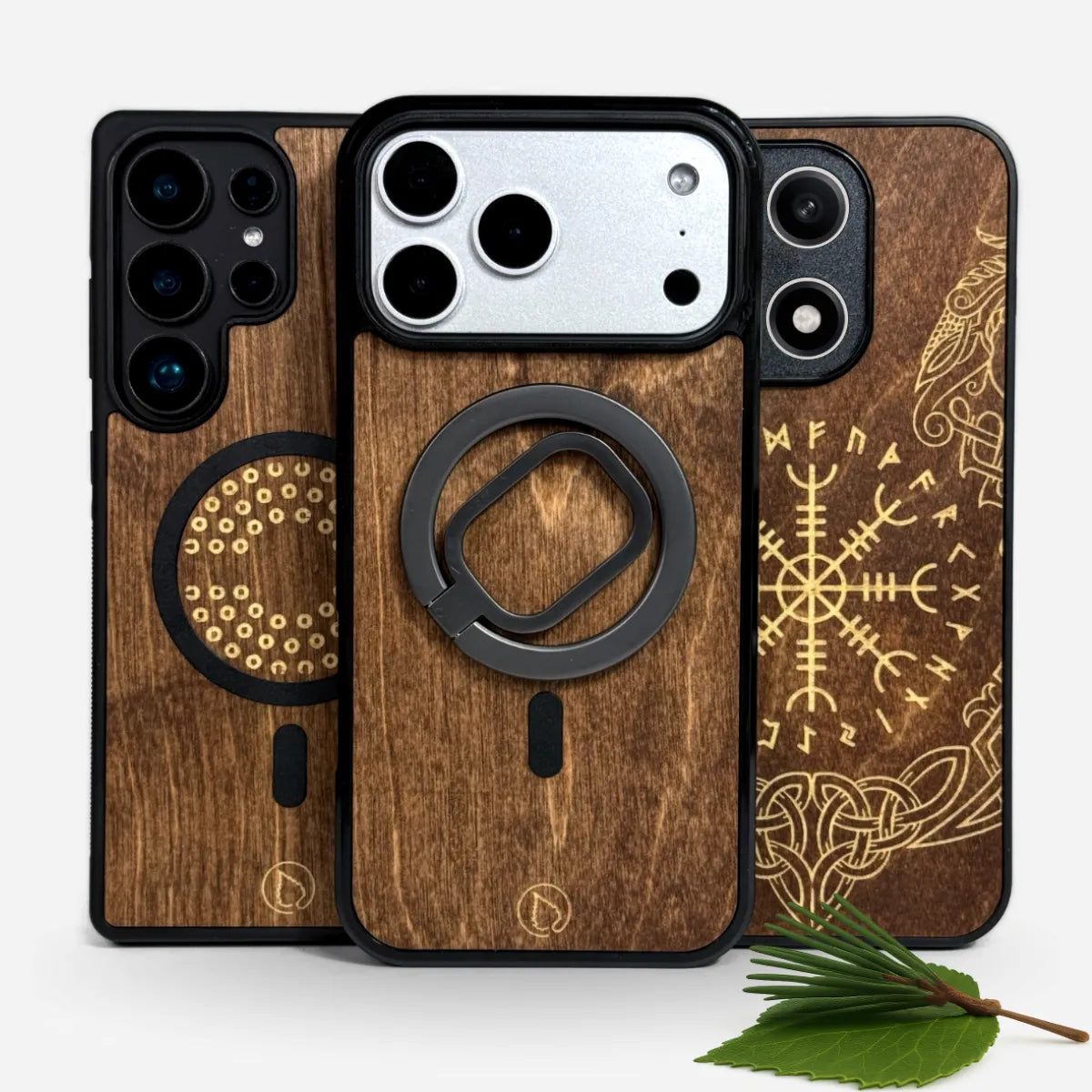 Lastu  Lastujen suojakuoret, tervapahkaa iPhone 17 Pro, Samsung S26 ja OnePlus 15, metallirengas, vihreitä lehtiä.