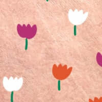 Colorful floral pattern with purple, orange, and white tulips on a soft pink background.